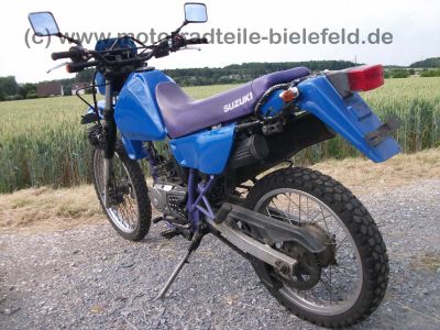 Suzuki_DR125SE_SF44A_blau_2x_Zylinderkopf_DR_GN_GZ_125_S_SE_125S_125SE_SF_43_44_SF43_SF44_A_B_43B_44A_GN125_GZ125_66.jpg